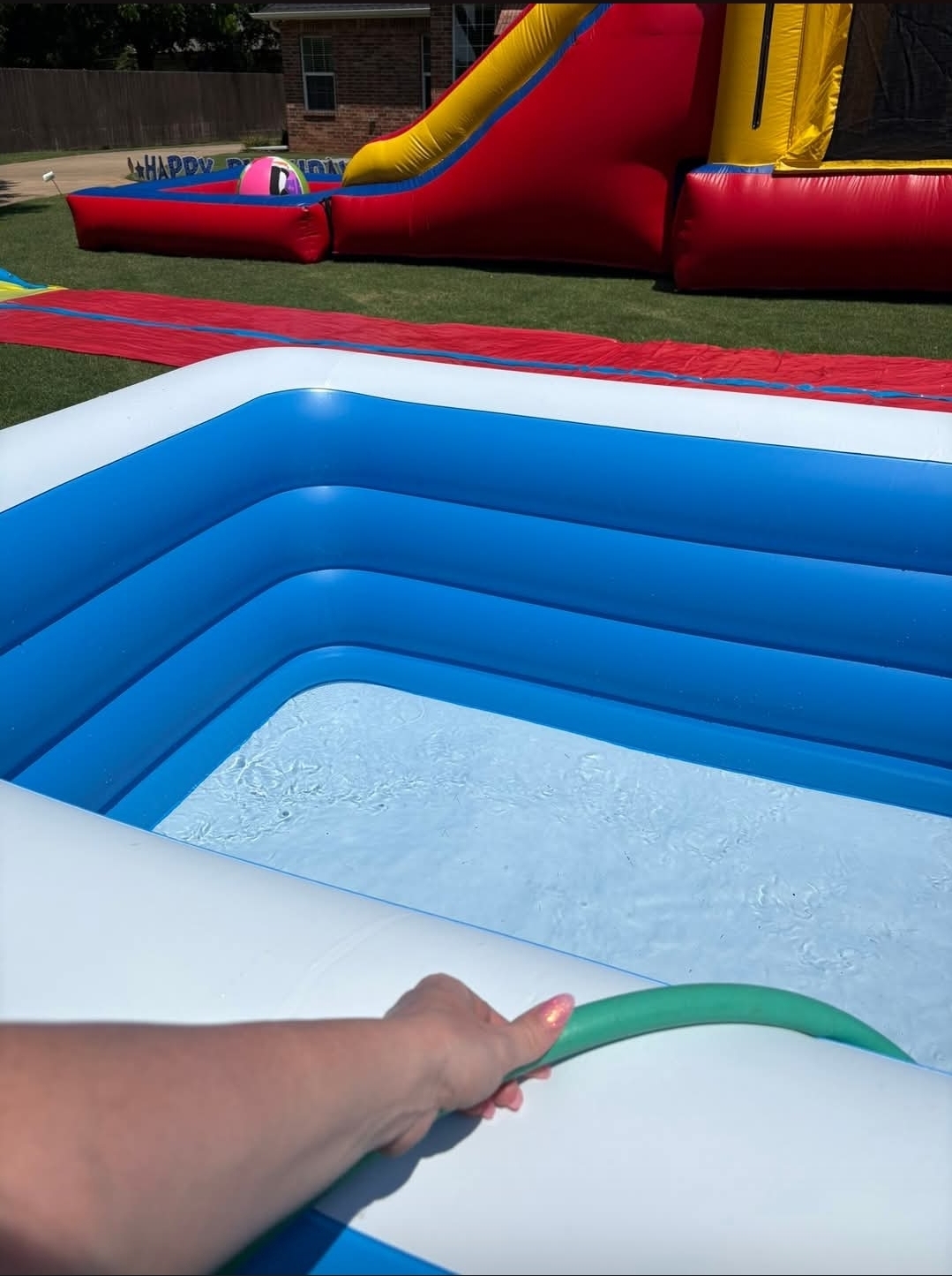 Inflatable water slide setup